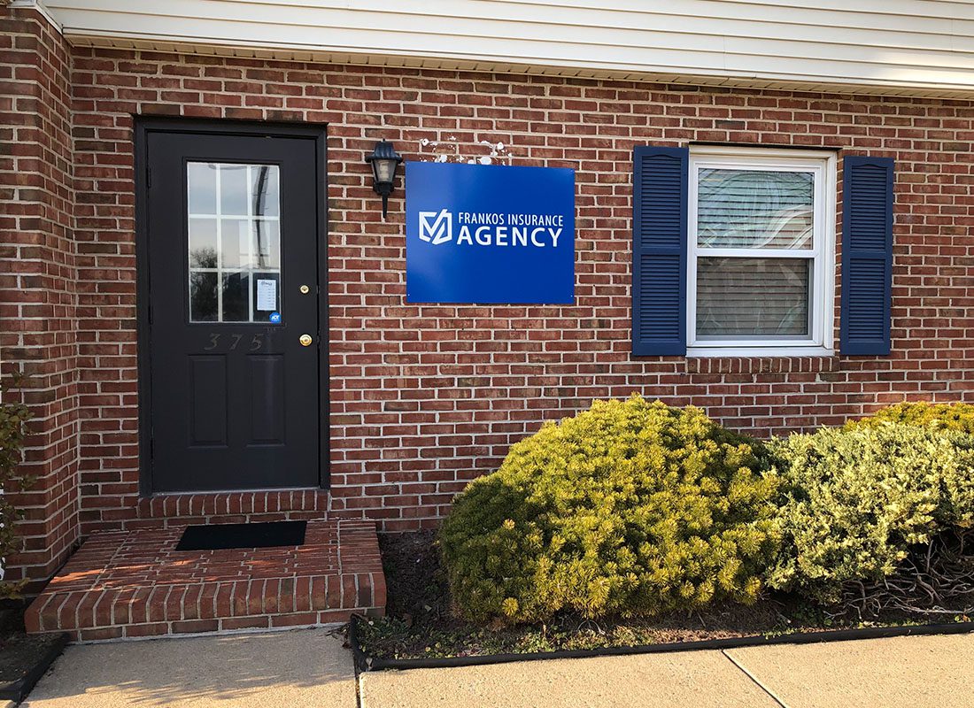 Dover, DE - Dover, DE Office of Frankos Agency With a Blue Agency Sign and a Brick Exterior